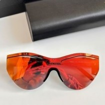 Balenciaga BB004S Shield aurinkolasit musta/oranssi
